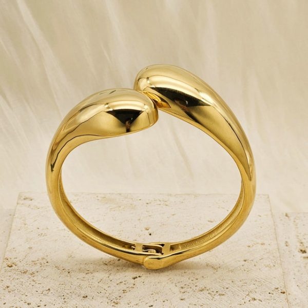 Geometric, glossy cross stainless steel bangle with asymmetric droplet double-headed design in INS style. - 图片 3