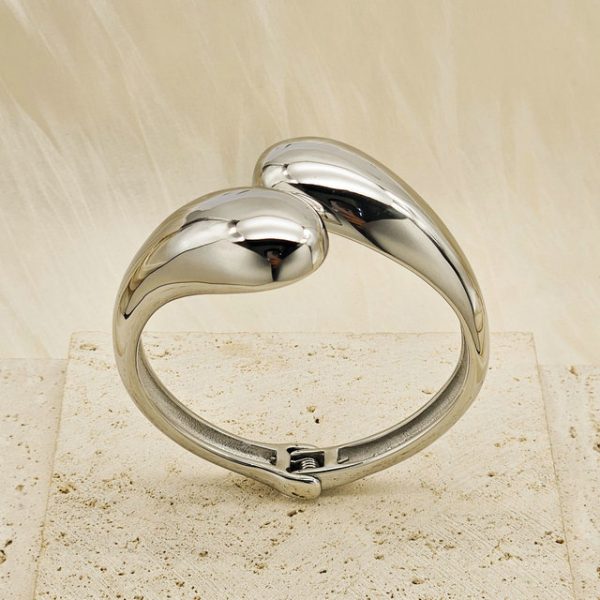Geometric, glossy cross stainless steel bangle with asymmetric droplet double-headed design in INS style. - 图片 4